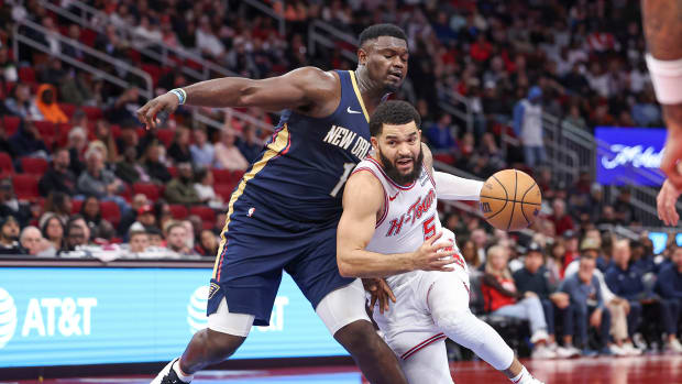 Rockets guard Fred VanVleet drives with the ball as New Orleans Pelicans forward Zion Williamson (1) defends during the third quarter at Toyota Center.